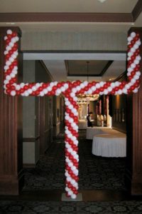 goal post balloon decoration with red and white balloons