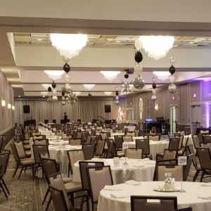 Do you need some special ceiling balloon decorations for your event? Let us show you how ceiling balloon decor can make any banquet room look Great!