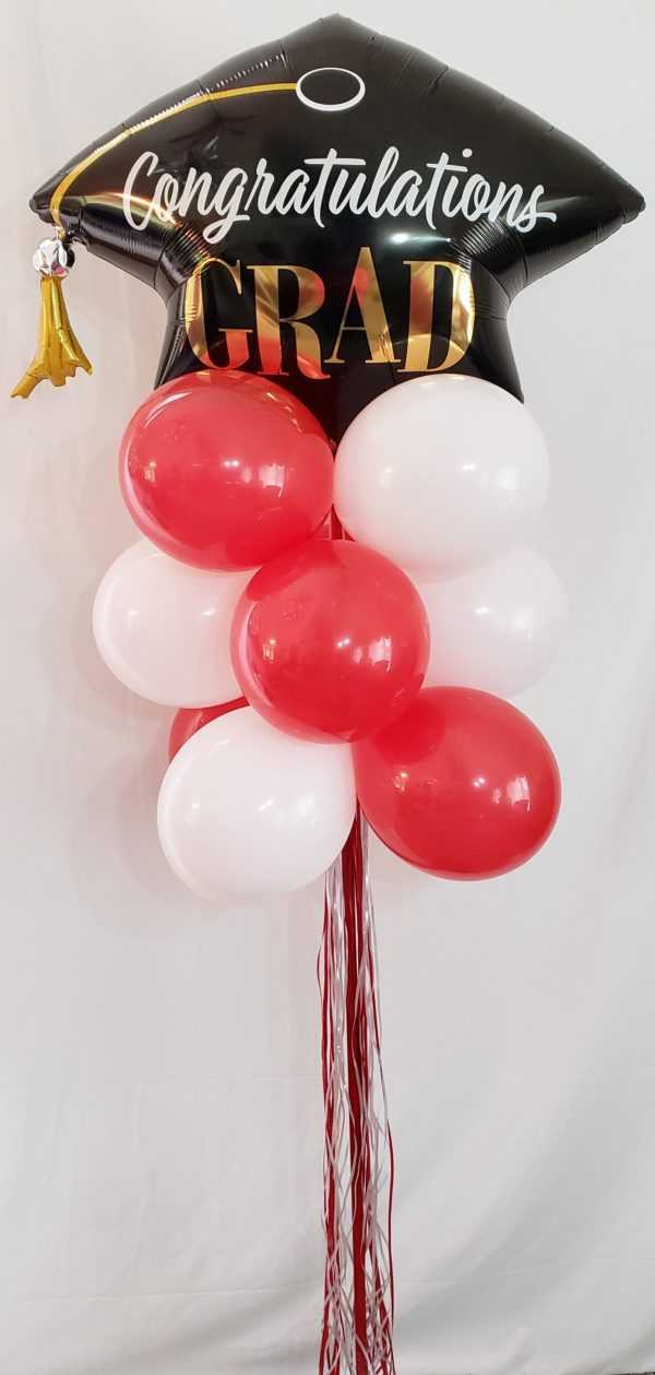 Do you need a special Grad theme balloon yard display? Let us make one of these for that graduate in your life using their school's colors.